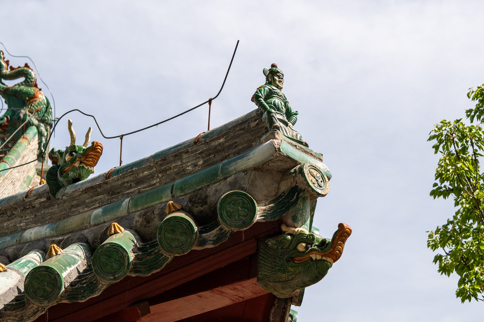 Additional roof detail of Chuzu Hall showing the roofline and ornamental termination.