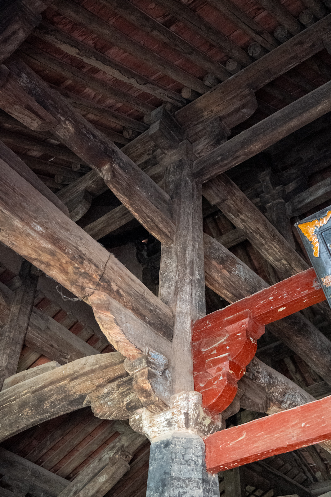 Interior view centred on a column where multiple beams and members converge.